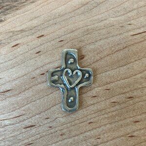 Small rustic metal cross silver tone token featuring a raised heart